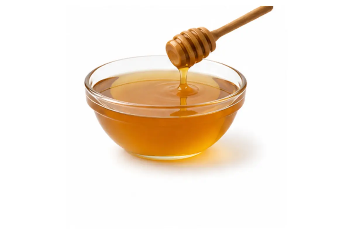 Golden artificial honey with honey dipper