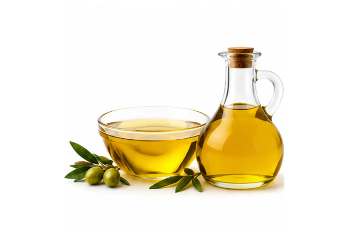 Edible oil in a glass bottle and bowl